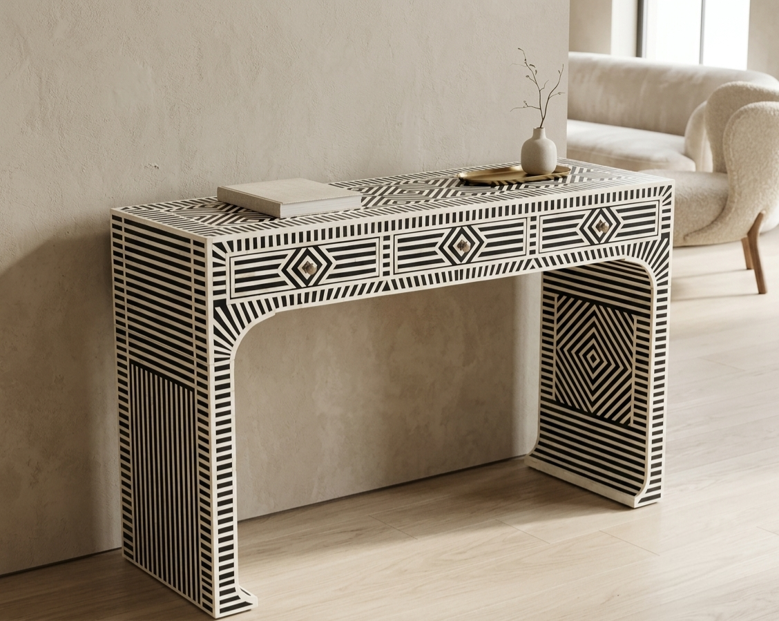 Black and white bone inlay console table with three drawers and geometric design