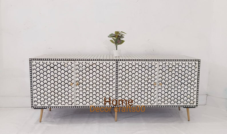 Black and white bone inlay 4-door TV unit with intricate Tagua design and tapered legs